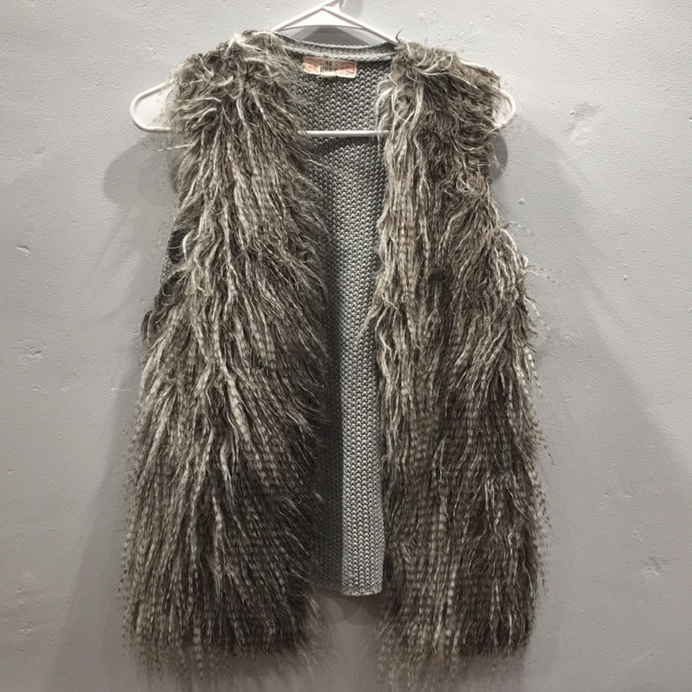 Furry gray sweater vest.